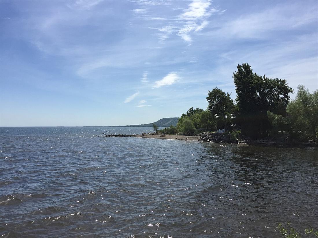 Georgian Bay waves rolling in at Thornbury harbour under a wide sky